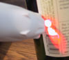 CueCat scanning a bottle.